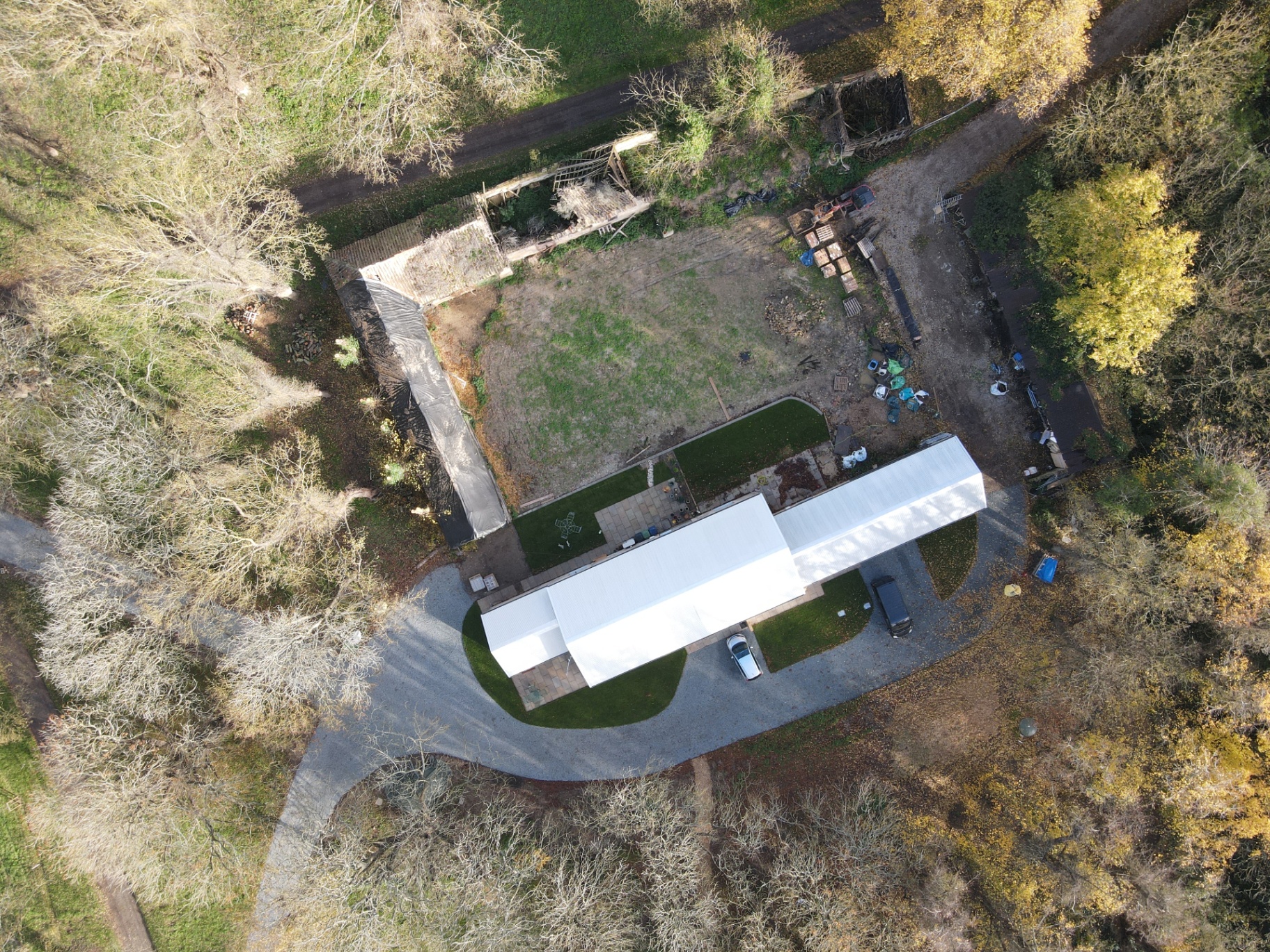 Aerial view of Abbey Farm with phase one complete and the old stables still to be restored